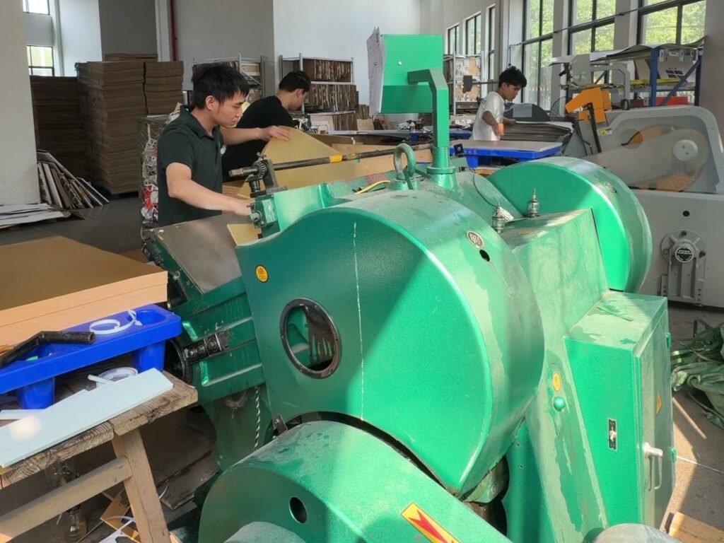 Worker feeding a die-cutting machine