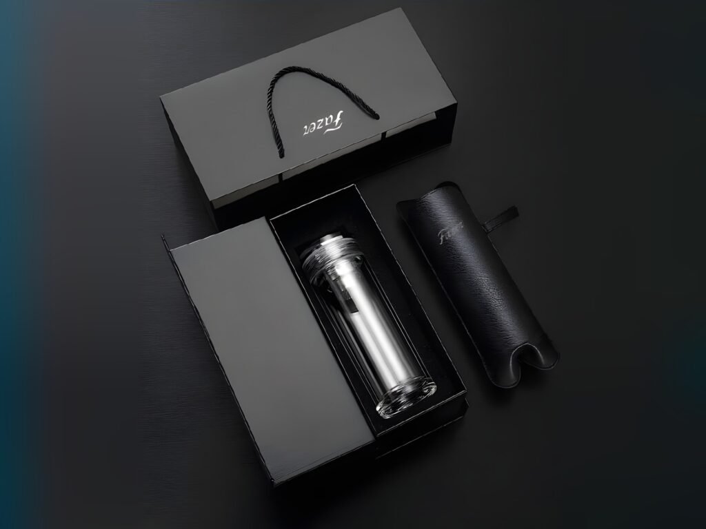 Black drinkware gift box with glass bottle and sleeve