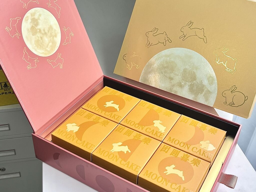 Pink flip-lid gift box with printed inner lid and six inner boxes