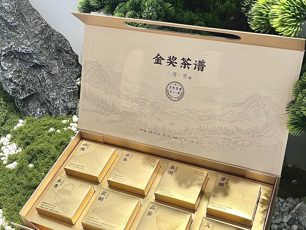 Kraft-look gift box opened to show a gold compartment tray