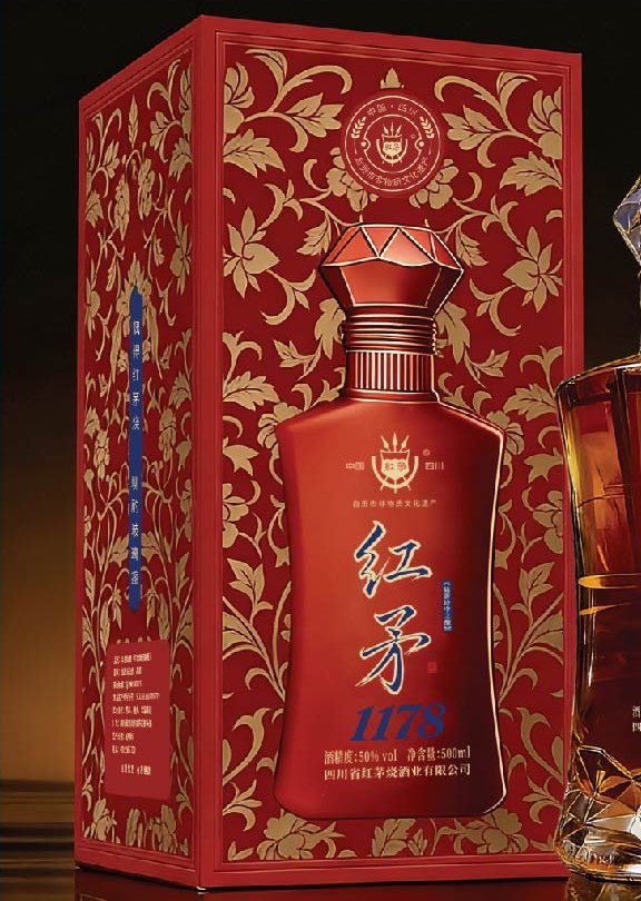 Red liquor gift box with gold floral print, shown with bottle